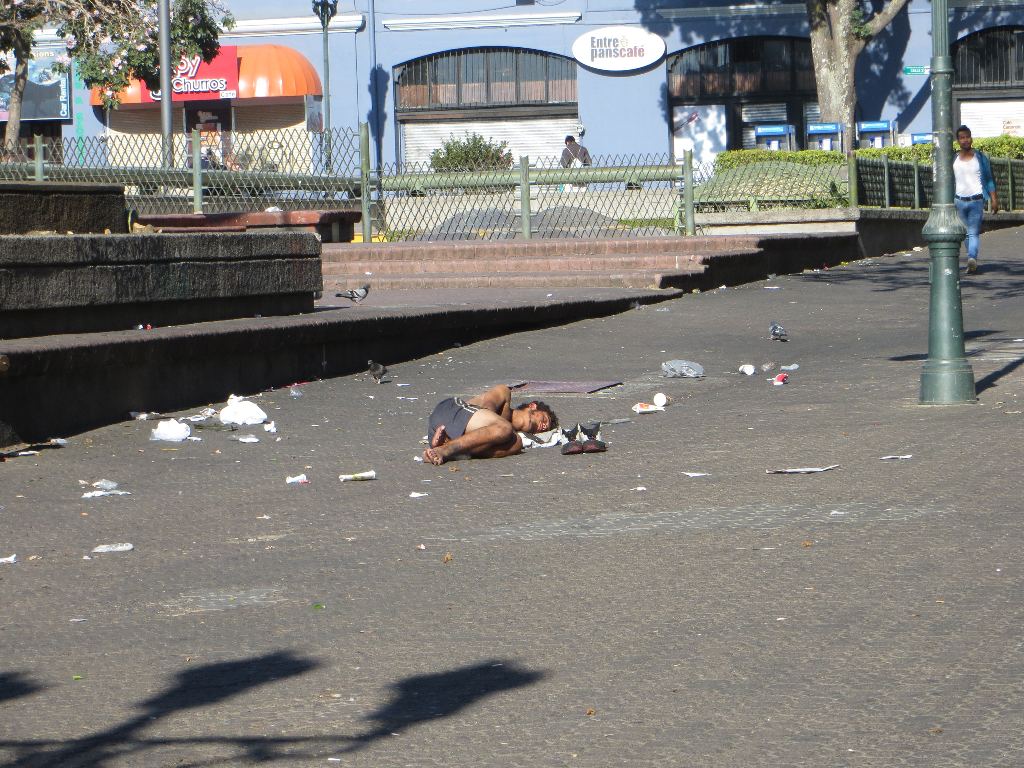 One of San José's homeless men takes advantage of Holy Week by sleeping unmolested in the middle of Avenida Central at the Plaza de la Cultura. Normally at 7:30 in the morning, this pedestrian walkway would be packed with tens of thousands of Ticos hurrying to work.