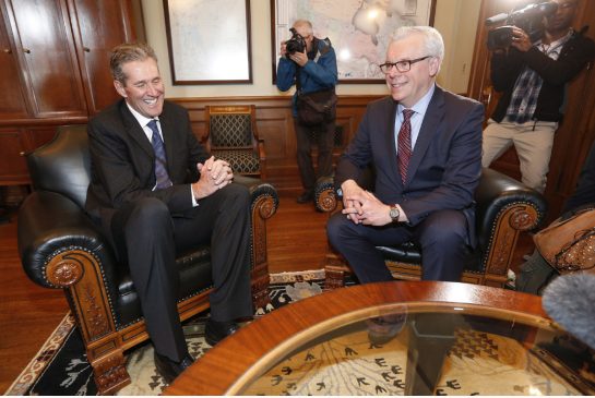 Manitoba Premier-elect Brian Pallister, left, meets former NDP premier Greg Selinger on Wednesday.