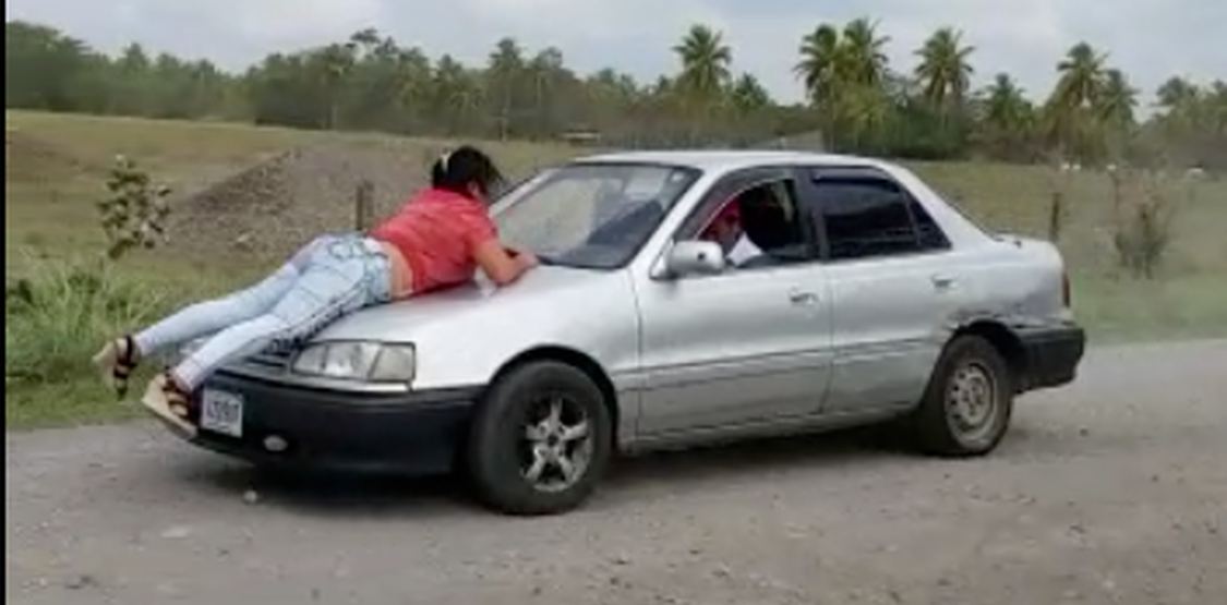 Woman holds on for life as her  jealous 'significant' drives off with her car. This on Monday in San Carlos, Costa Rica