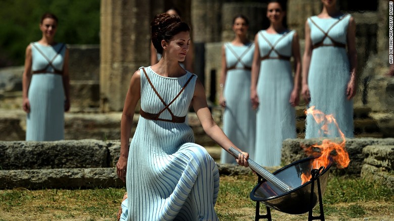 Rio 2016: Olympic torch lit The Olympic flame is back: Greek actress Katerina Lechou performs the role of the high priestess as she lights the Olympic flame at the Temple of Hera at the site of ancient Olympia.