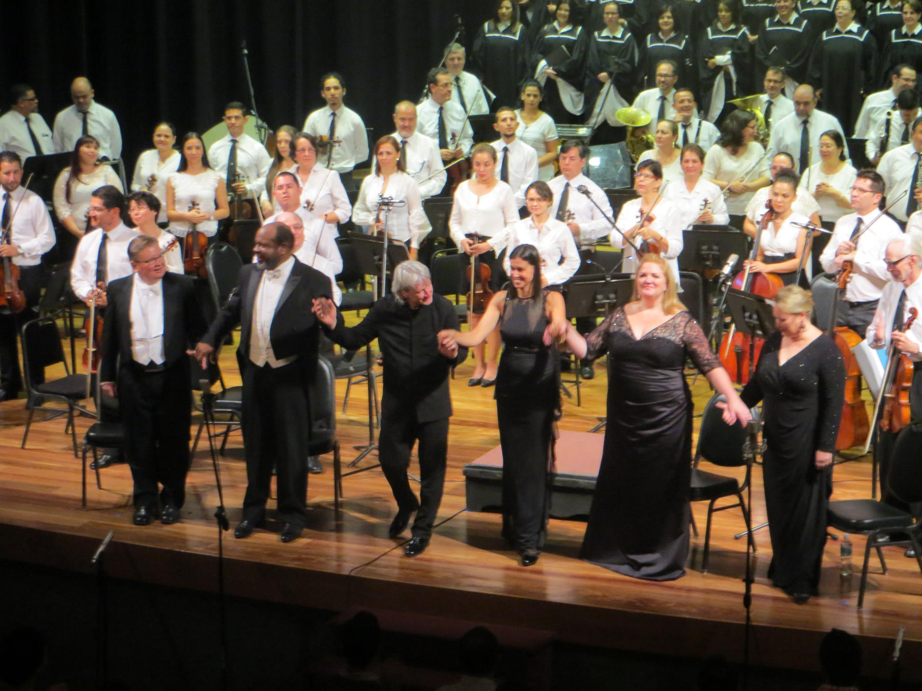 Soloists and conductor take a bow after Beethoven's 9th Symphony.