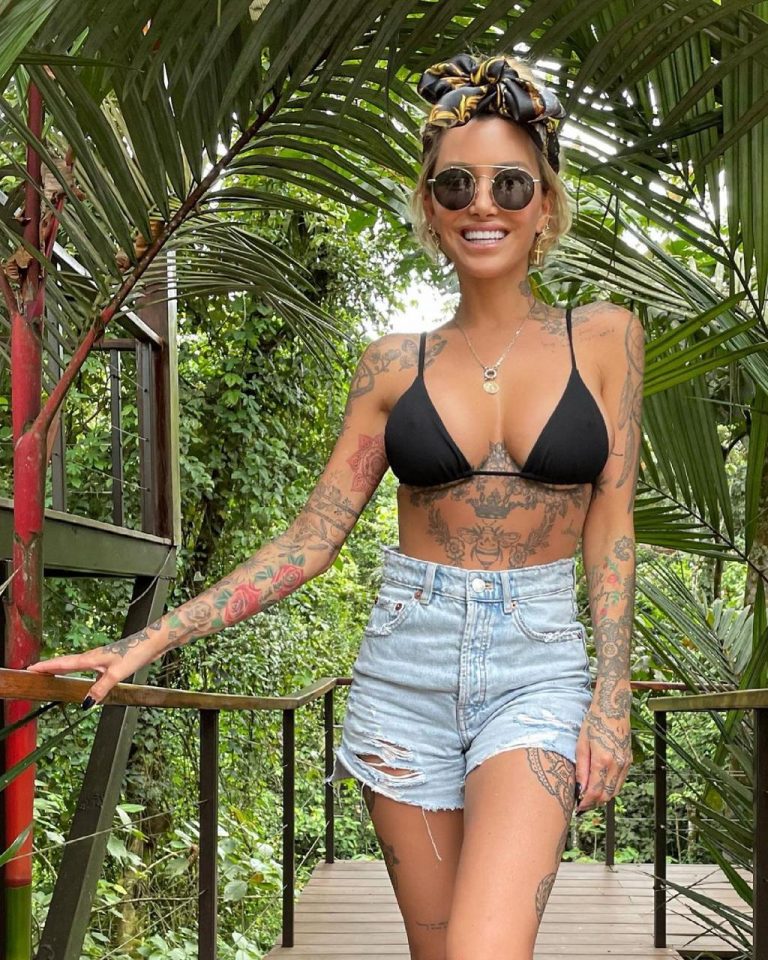 Bombshell Tina Louise flaunts her tiny bikini after celebrating her 40th in Costa Rica